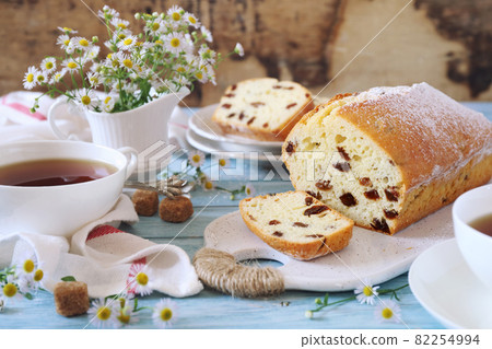 Homemade Raisin cake and two cups of tea Homemade Raisin cake and two cups of tea 82254994