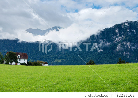 Beautiful mountains landscape in Switzerland Alps. Small house 82255165