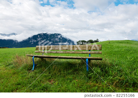 A calm place to rest and relax. An empty wooden bench. Switzerland 82255166