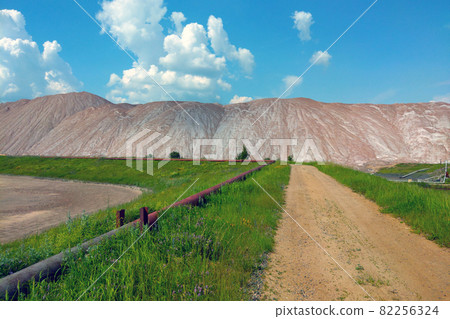 View of large industrial mountains of spent ore, mining. View of large industrial mountains of spent ore, mining. 82256324