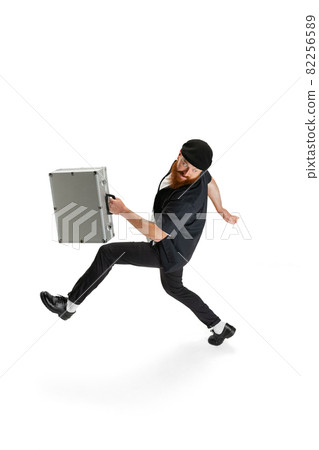 Portrait of stylish bearded man, barber or hair cutter isolated on white studio background. Holding his working equipment. Portrait of stylish bearded man, barber or hair cutter isolated on white studio background. Holding his working equipment. 82256589