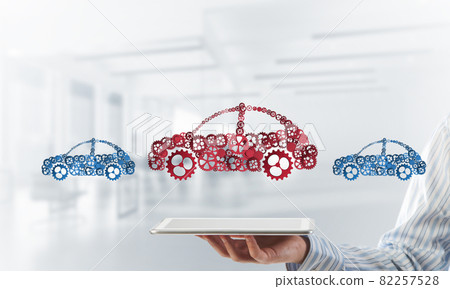 Close of businessman holding tablet pc with car icon on screen 82257528