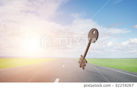 Conceptual background image of concrete key sign on asphalt road Conceptual background image of concrete key sign on asphalt road 82259267