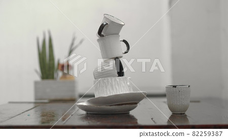 Dishware tower under the rain Dishware tower under the rain 82259387