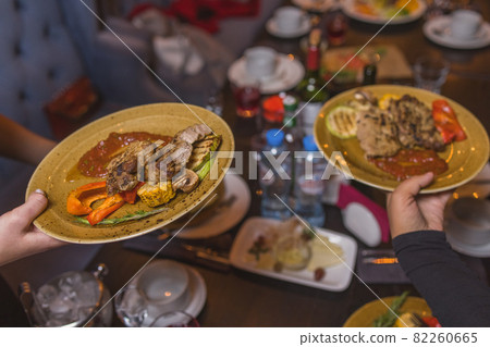 Grilled Steak Striploin and Pepper sauce on cutting board on dark wooden background. Grilled Steak Striploin and Pepper sauce on cutting board on dark wooden background. 82260665