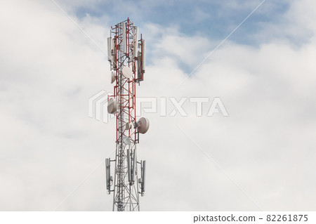 Mobile communication network communication tower with antens on the background of the sky Mobile communication network communication tower with antens on the background of the sky 82261875