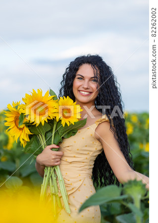 Portrait of a beautiful smiling dark-haired woman 82262002