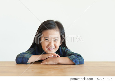 Girl laughing on the table 82262292