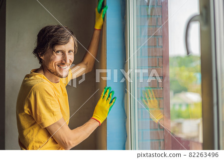 Builder or handyman is engaged in the repair or installation of windows 82263496