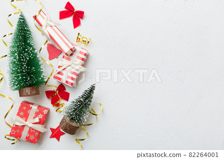 New Year composition. Christmas decor background with gift boxes. Top view with copy space 82264001