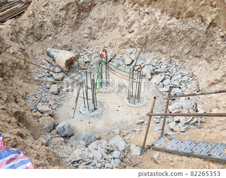 PENANG, MALAYSIA -SEPTEMBER 2, 2021: The process of cutting piles after the completion of building foundation piling work. This work needs to be done before the construction of the cap pile is proceed PENANG, MALAYSIA -SEPTEMBER 2, 2021: The process of cutting piles after the completion of building foundation piling work. This work needs to be done before the construction of the cap pile is proceed 82265353