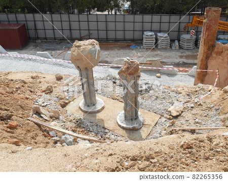 PENANG, MALAYSIA -SEPTEMBER 2, 2021: The process of cutting piles after the completion of building foundation piling work. This work needs to be done before the construction of the cap pile is proceed PENANG, MALAYSIA -SEPTEMBER 2, 2021: The process of cutting piles after the completion of building foundation piling work. This work needs to be done before the construction of the cap pile is proceed 82265356
