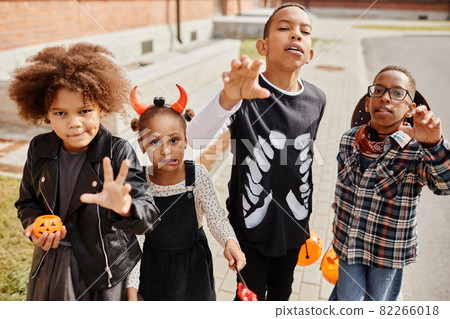 African American Kids Trick or Treating in Street African American Kids Trick or Treating in Street 82266018