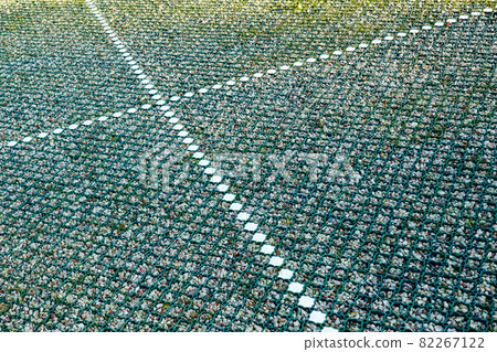 new modern car park gravel base with a installed green plastic grid new modern car park gravel base with a installed green plastic grid 82267122