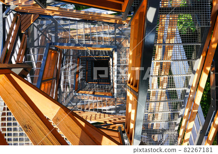 a fragment of the structure of a new modern metal observation tower with decorative wooden elements 82267181