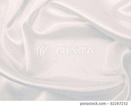 Smooth elegant grey silk or satin luxury cloth as wedding background. Luxurious background design Smooth elegant grey silk or satin luxury cloth as wedding background. Luxurious background design 82267232