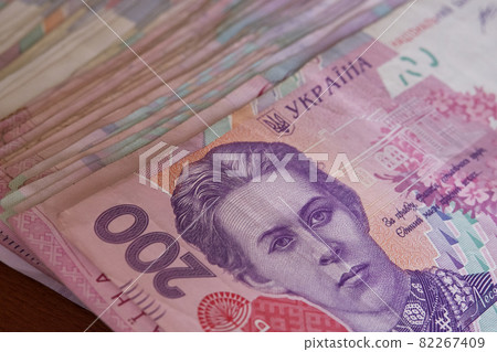 A bunch of banknotes with a face value of two hundred hryvnias. Ukrainian money. 82267409