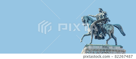 Banner with top roof sculpture of Greek goddess Muse riding Pegasus, a winged horse, at Vienna State Opera House, Vienna, Austria, with copy space. Concept of Cultural Heritage and Travel. 82267487