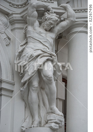 Cityscape of architecture and statues of powerful and emotional atlas of Renaissance Era at Kinsky Palais building in Vienna in Vienna historical and touristic downtown, Vienna, Austria. Cityscape of architecture and statues of powerful and emotional atlas of Renaissance Era at Kinsky Palais building in Vienna in Vienna historical and touristic downtown, Vienna, Austria. 82267496