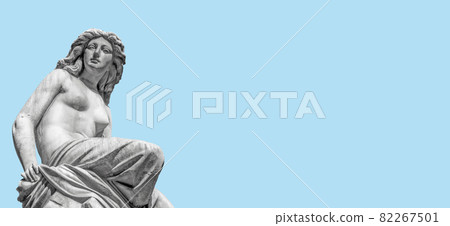 Banner with top fountain statue of beautiful woman as musician, Muse, and singer of State Opera fountain in Vienna, Austria, with blue sky solid background with copy space. Banner with top fountain statue of beautiful woman as musician, Muse, and singer of State Opera fountain in Vienna, Austria, with blue sky solid background with copy space. 82267501