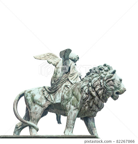 Statue of a big lion with genius of music, an angel with wings and a musical instrument at Concert Hall (Konzerthaus), in Berlin, Germany, isolated at white background. Statue of a big lion with genius of music, an angel with wings and a musical instrument at Concert Hall (Konzerthaus), in Berlin, Germany, isolated at white background. 82267866