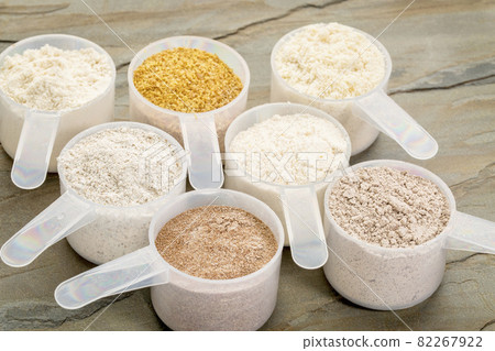 scoops of gluten free flour 82267922