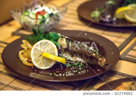 Fried fish with fresh lemon 82274862