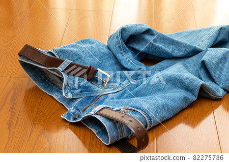Jeans thrown off on the floor 82275786