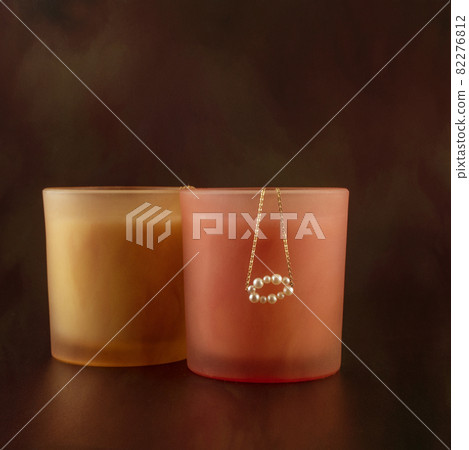 Pearl Pendant On Colored Glass With Textured Background 82276812