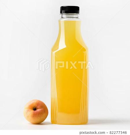 front view juice glass bottle with peach. High quality and resolution beautiful photo concept front view juice glass bottle with peach. High quality and resolution beautiful photo concept 82277346