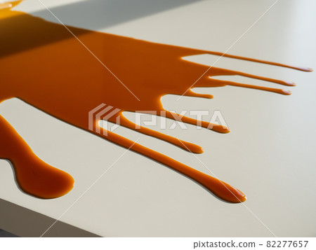 Cup of black coffee spilled on white work table. Cup of black coffee spilled on white work table. 82277657