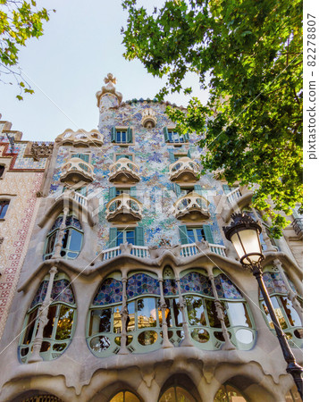 n old building made in unusual architectural style, greenery 82278807