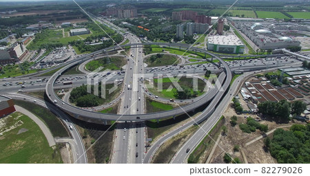 Flying over busy interchange with circular transport traffic in Moscow, Russia Flying over busy interchange with circular transport traffic in Moscow, Russia 82279026
