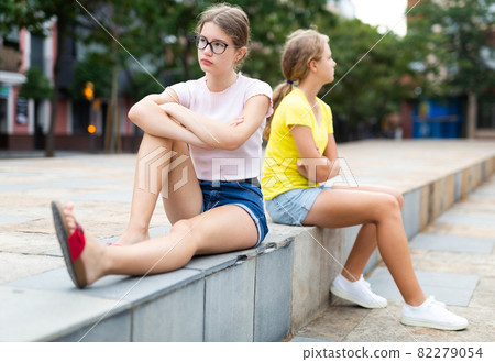Two girlfriends after quarrel do not want to talk to each other Two girlfriends after quarrel do not want to talk to each other 82279054