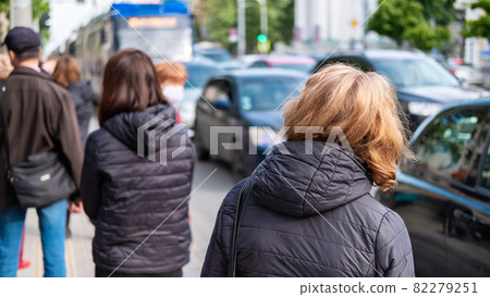 Multiple people waiting for the transport on a station 82279251