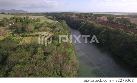 Flying over the river on Mauritius Island Flying over the river on Mauritius Island 82279308