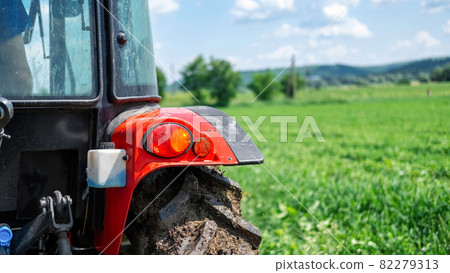 Rear view of a tractor in the nature Rear view of a tractor in the nature 82279313