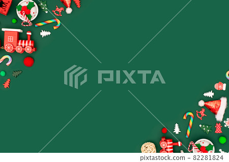 Christmas or New Year green background with diagonal red toys borders. Christmas or New Year green background with diagonal red toys borders. 82281824
