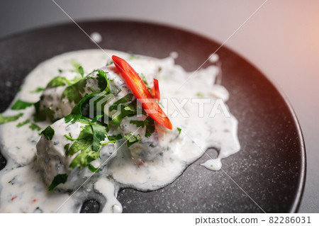 traditional georgian food gebjalia with matsoni cheese and red chili pepper traditional georgian food gebjalia with matsoni cheese and red chili pepper 82286031