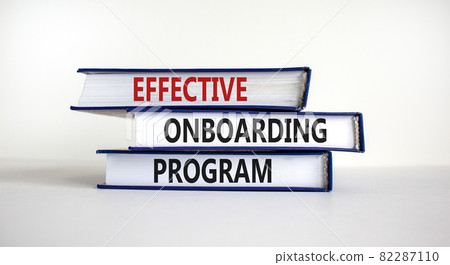 Effective onboarding program symbol. Books with words 'effective onboarding program' on beautiful white background. Business and effective onboarding program concept. Copy space. Effective onboarding program symbol. Books with words 'effective onboarding program' on beautiful white background. Business and effective onboarding program concept. Copy space. 82287110