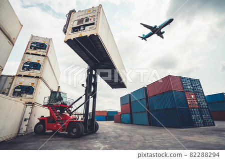 Cargo container for overseas shipping in shipyard with airplane in the sky . 82288294