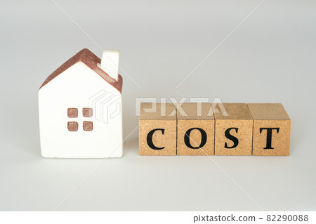 Housing cost concept (miniature house and the word COST) 82290088