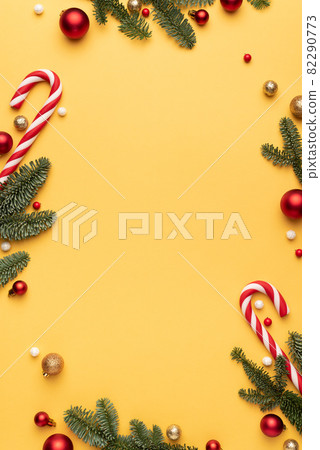 Yellow Christmas background with holiday frame 82290773