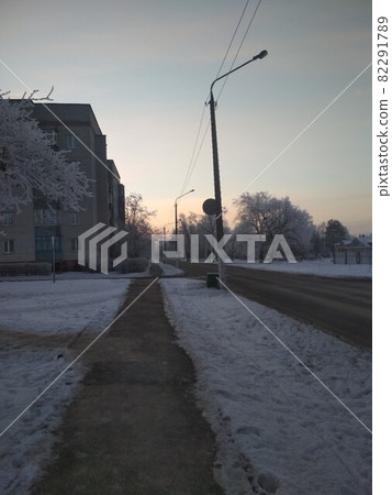 winter cityscape. road with snow trees and houses new year Christmas on the street winter cityscape. road with snow trees and houses new year Christmas on the street 82291789