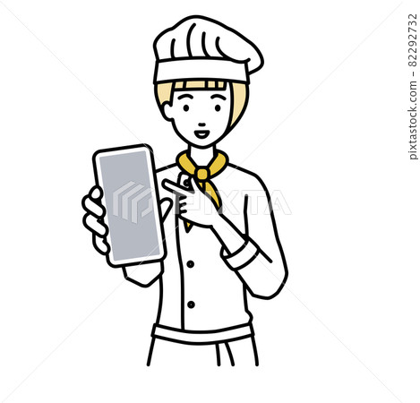 A cook woman standing and pointing at her smartphone A cook woman standing and pointing at her smartphone 82292732