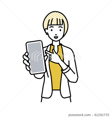 A woman in a jacket standing and pointing at her smartphone A woman in a jacket standing and pointing at her smartphone 82292735