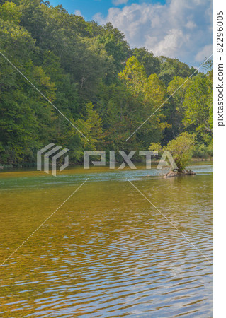 The Current River flows through the Ozark National Scenic Riverway through the mountains of Missouri The Current River flows through the Ozark National Scenic Riverway through the mountains of Missouri 82296005