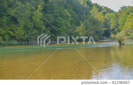The Current River flows through the Ozark National Scenic Riverway through the mountains of Missouri The Current River flows through the Ozark National Scenic Riverway through the mountains of Missouri 82296007