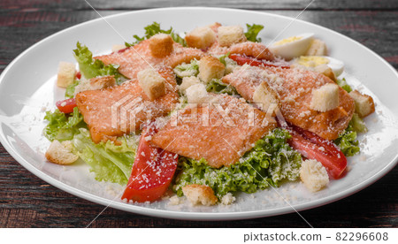 Delicious fresh salad with red fish for the festive table Delicious fresh salad with red fish for the festive table 82296608