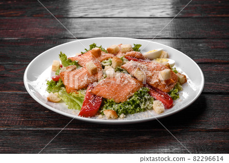 Delicious fresh salad with red fish for the festive table Delicious fresh salad with red fish for the festive table 82296614